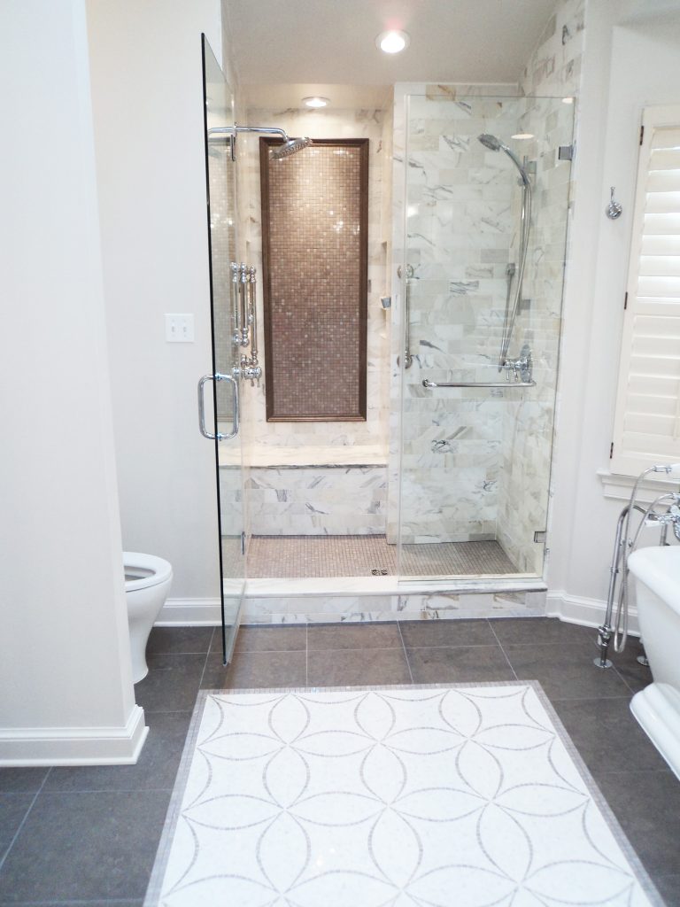 bathroom renovation free standing tub large shower tile rug feature