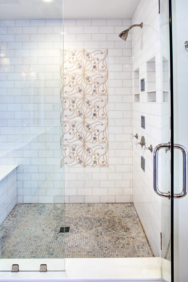 traditional bathroom large shower stall with glass door and tile features built-in bench and storage nooks
