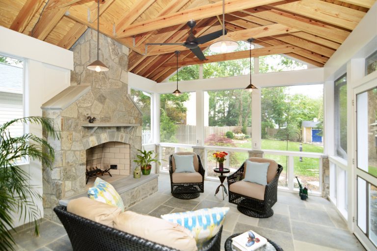 screened-in porch addition natural wood ceiling flagstone floor fireplace with ceiling fan