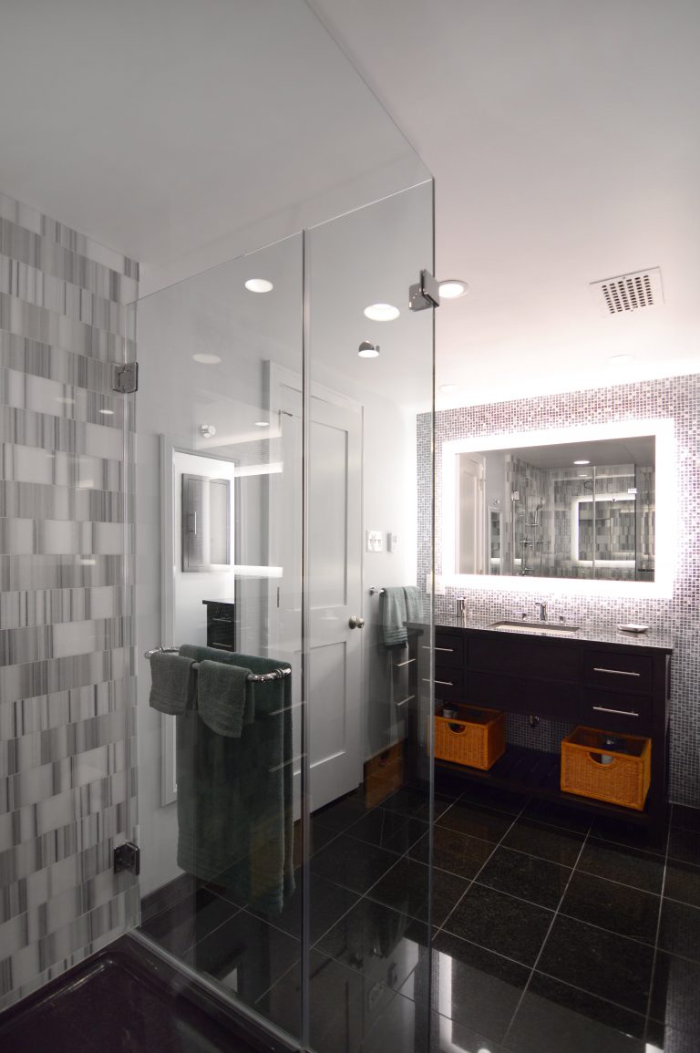 modern bathroom in dc condo large shower stall with glass doors backlit mirror
