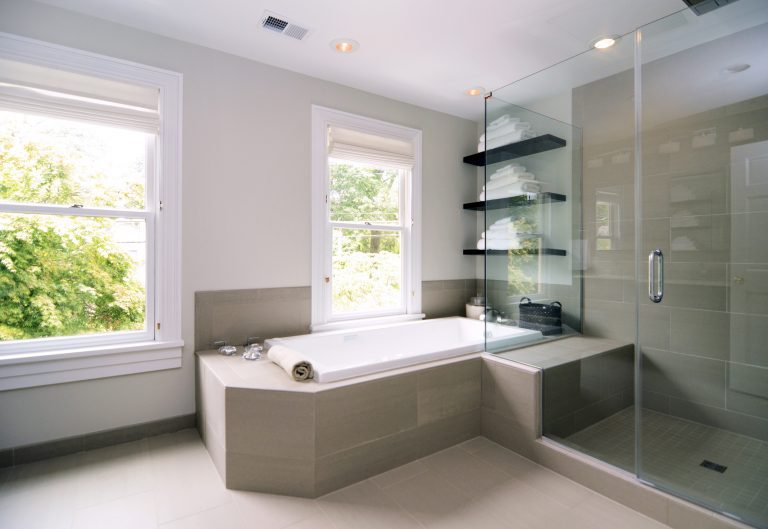 spa style bathroom neutral colors separate tub and shower stall open shelving