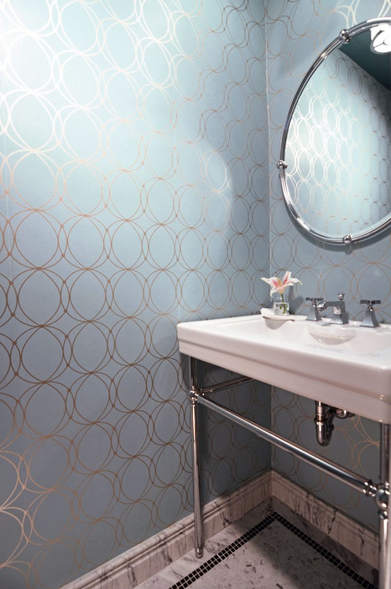 traditional powder room with touch of glam blue and silver geometric wallpaper