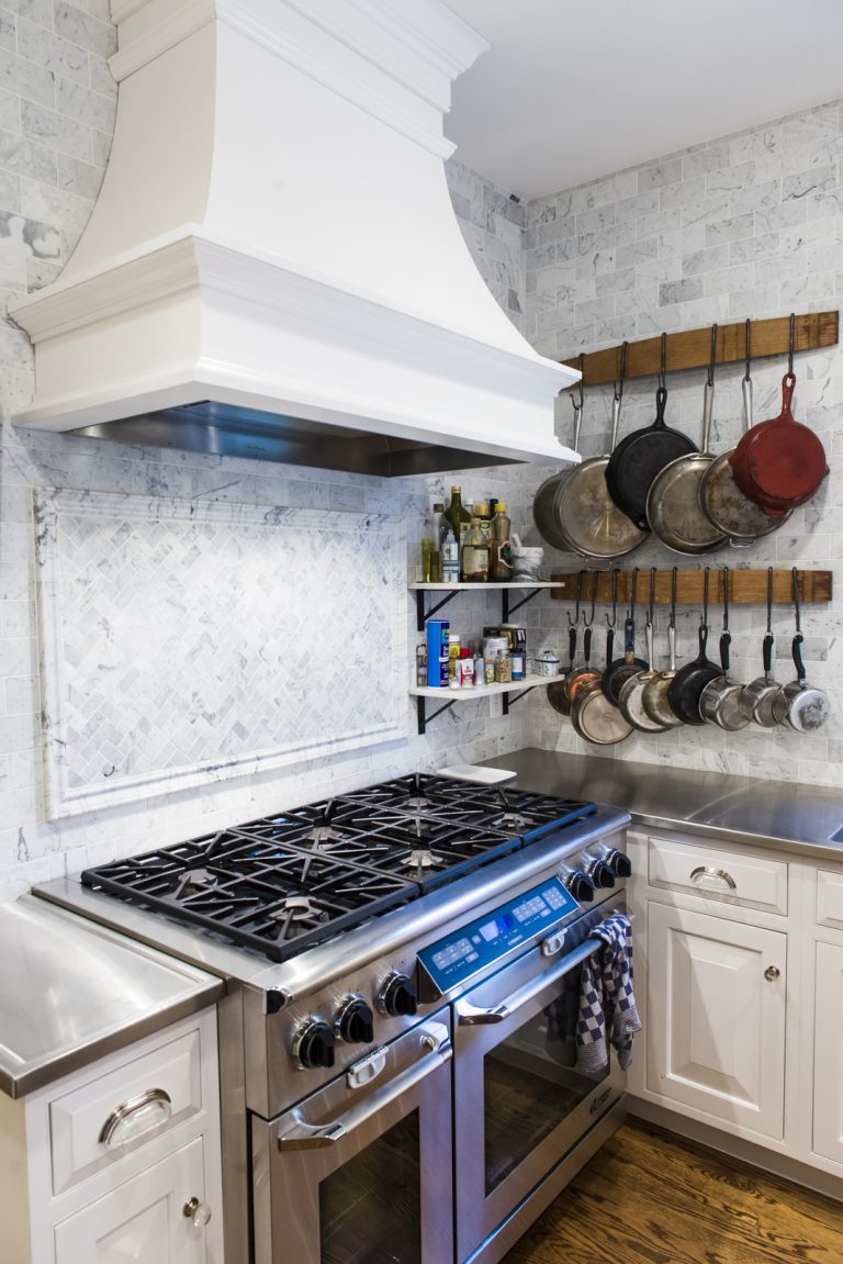 stainless steel gas range vent hood white cabinetry