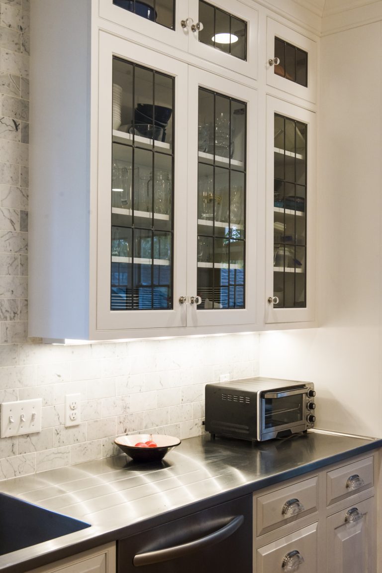 white glass door upper cabinets eclectic farmhouse kitchen stainless steel appliances