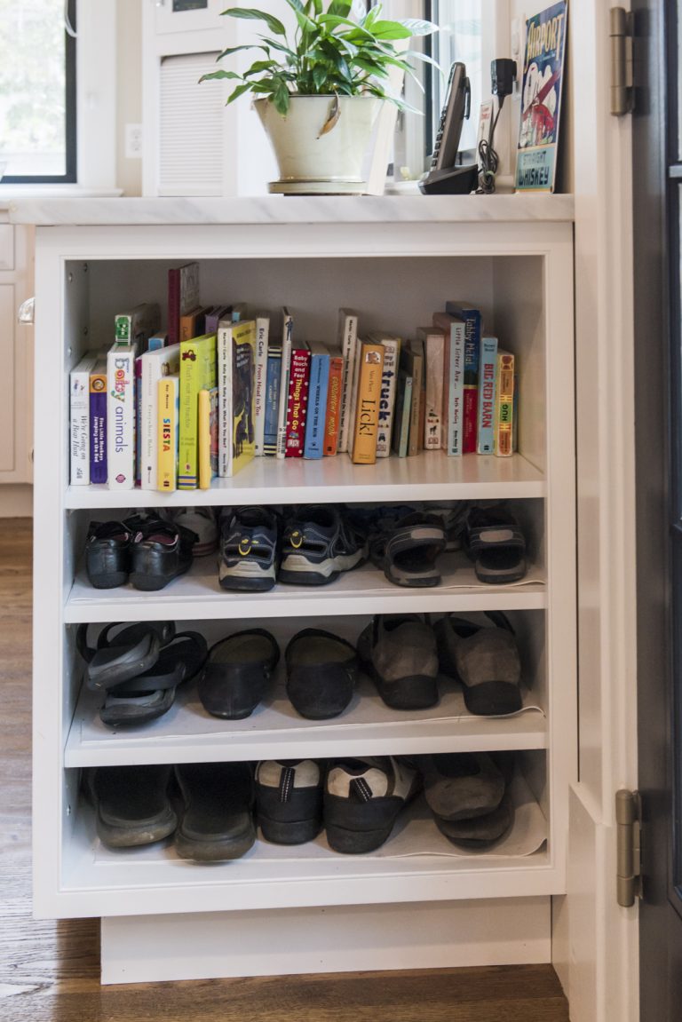 end of cabinets in kitchen with open storage shelving