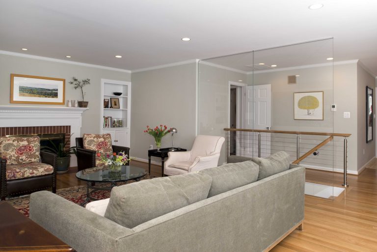 renovated living area in virginia home featuring glass wall