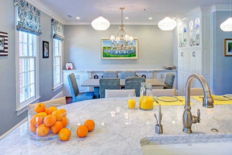 bright white kitchen flows into eating area