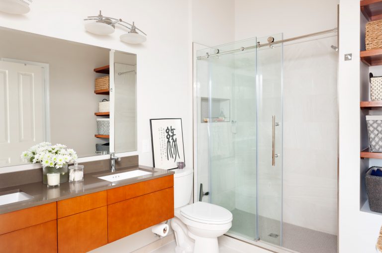 modern bathroom floating wood vanity sliding glass shower doors and built in storage