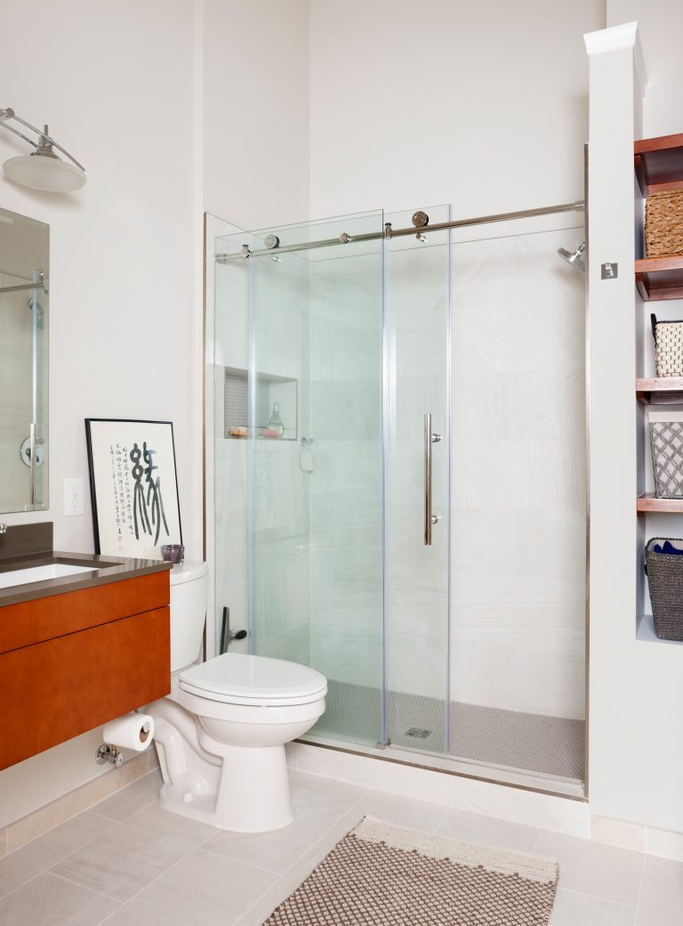 modern bathroom floating wood vanity sliding glass shower doors and built in storage