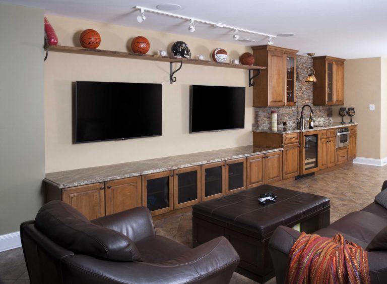 home sports bar built-in entertainment storage medium stained cabinetry two wall mounted flat screen tvs