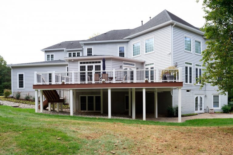 second story back deck addition on maryland home glass doors lead out to deck