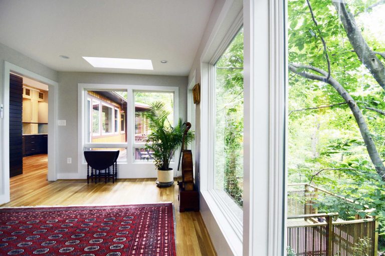 updated living area big windows skylight wood floors brighten up space