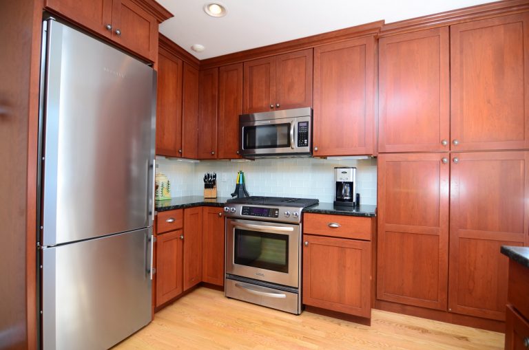 traditional kitchen with medium wood cabinetry and stainless steel appliances