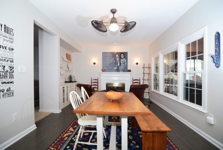 dining area with dark wood floors natural wood table with bench seating