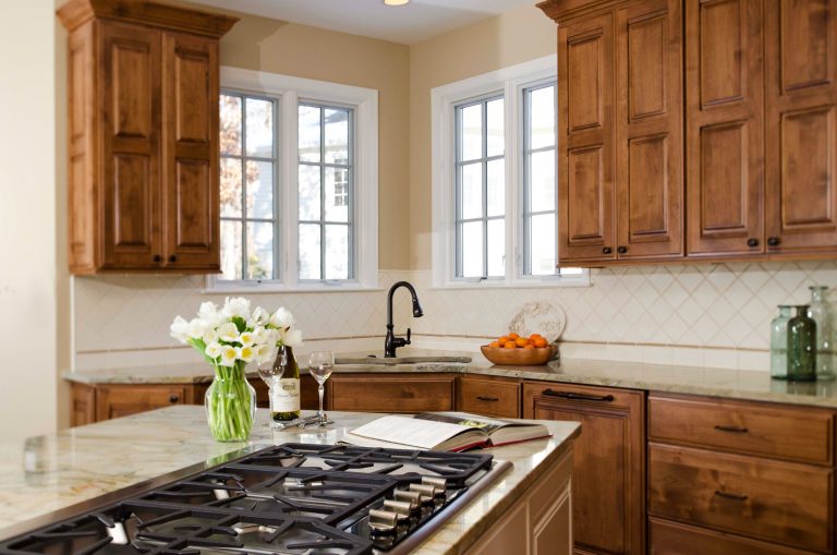 traditional Virginia kitchen medium stain cabinets corner sink gas range in island