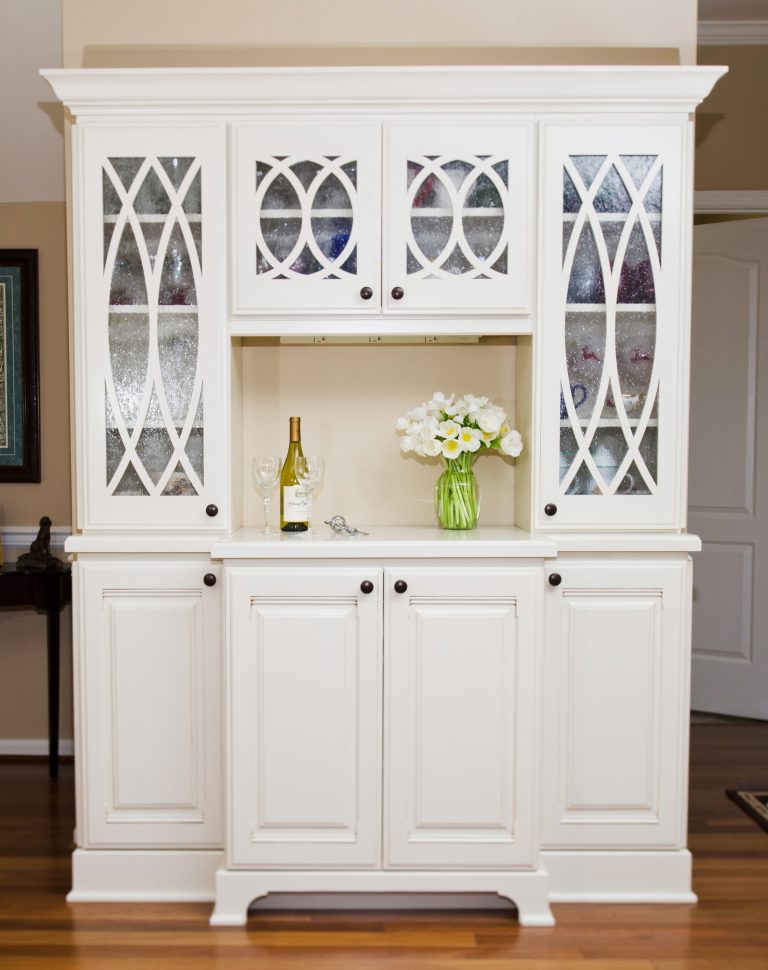 white cabinetry built-in hutch with glass upper doors