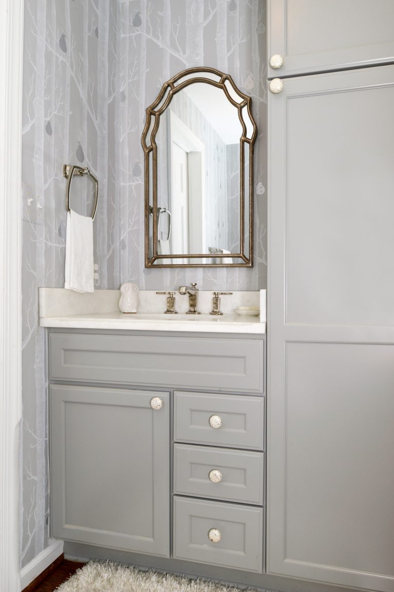 elegant bathroom vanity gray cabinetry bird and tree wallpaper