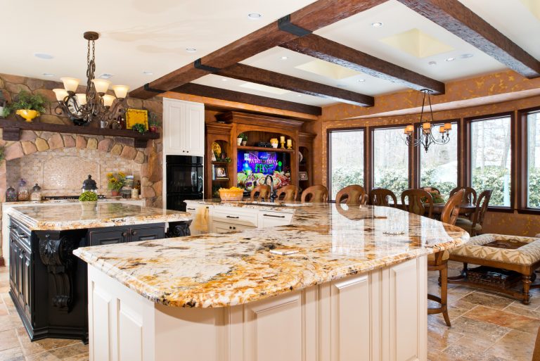 virginia home kitchen remodel bright and warm stone features exposed wood beams double island flows into living space