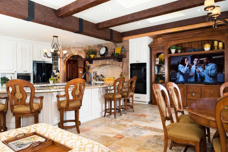 virginia home kitchen remodel warm colors stone features exposed wood beams flows into dining area