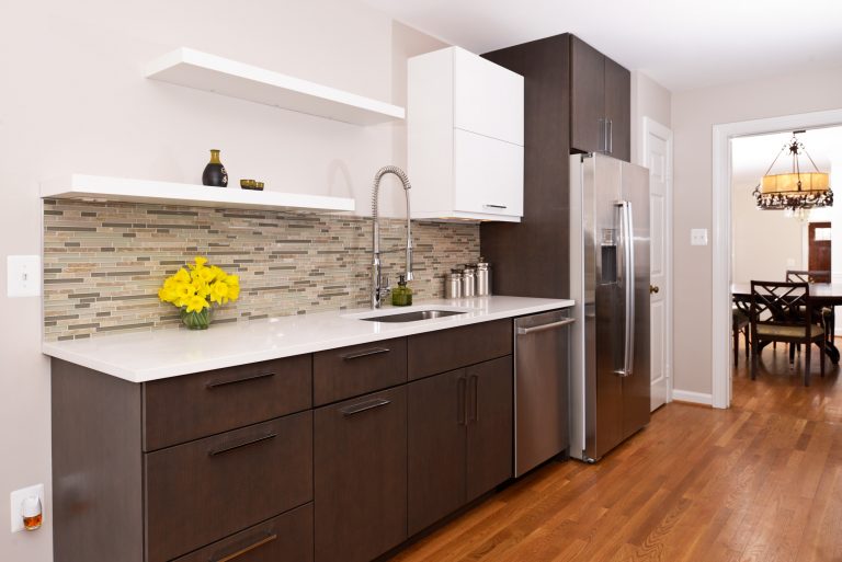 modern kitchen dark cabinetry open shelving wood floors mosaic tile backsplash neutral color palette