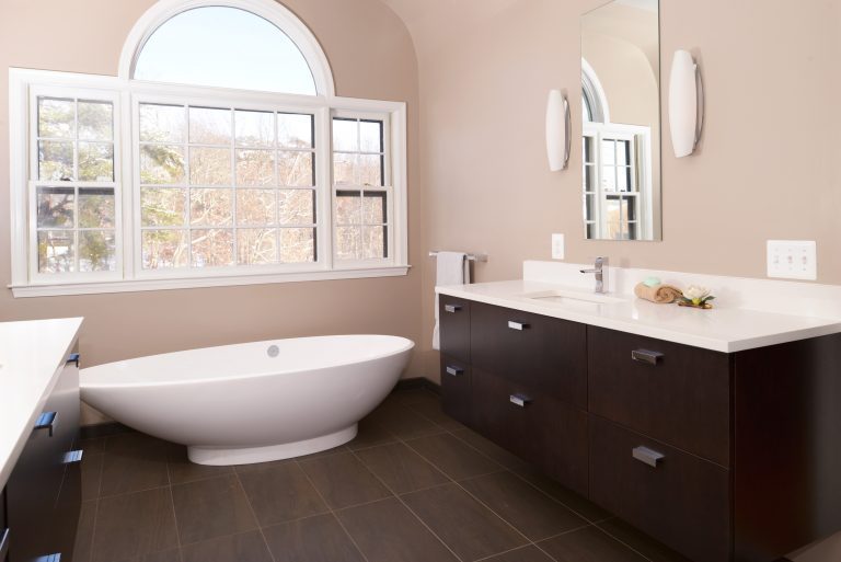 sleek modern bathroom wood vanity shower bench pink walls freestanding tub bay window