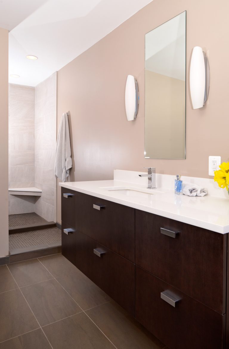 sleek modern bathroom wood vanity shower bench pink walls