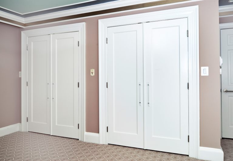 his and hers closets in renovated master suite neutral pink color palette