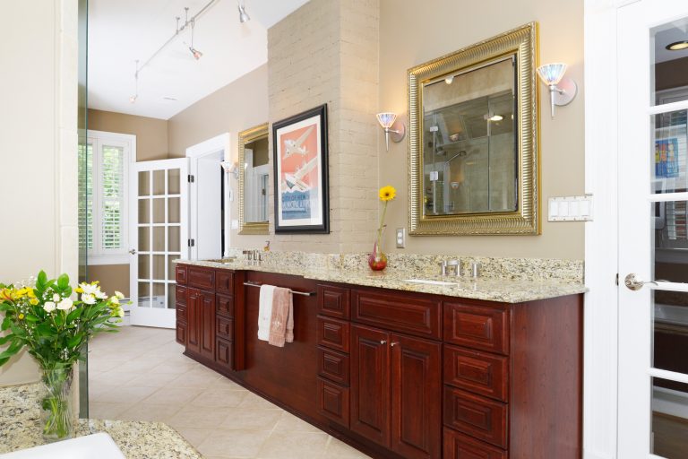 double sink dark wood vanity lots of counterspace traditional style tan neutral color palette