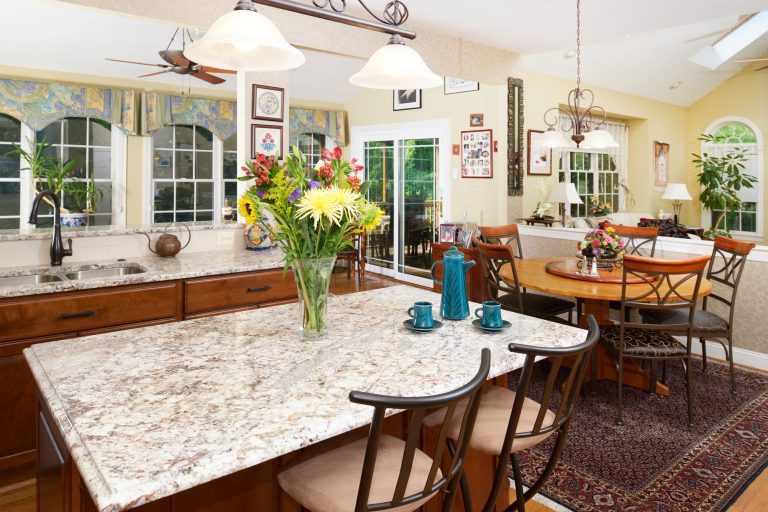traditional country style eat in kitchen warm color palette island with seating