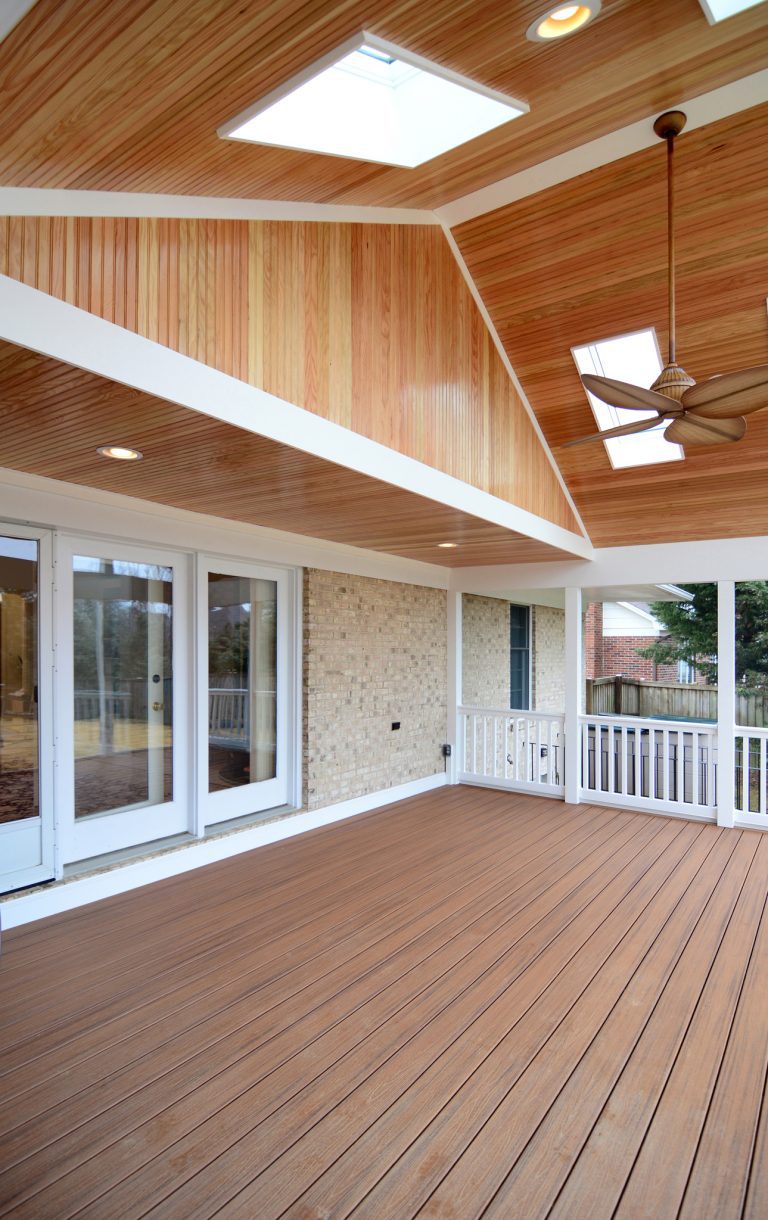screened in porch addition sliding glass doors vaulted wood ceiling with skylights and ceiling fan