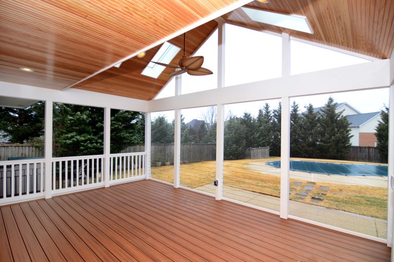 large screened in porch addition with vaulted wood ceiling and skylights