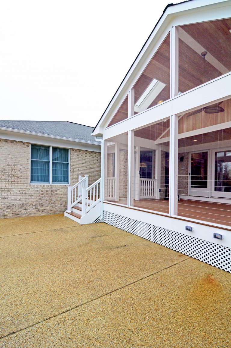 screened in porch addition with stairs out to yard