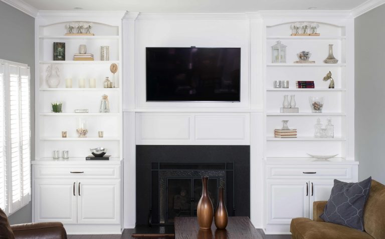 white cabinetry built ins around fireplace in family room plenty of storage entertainment center