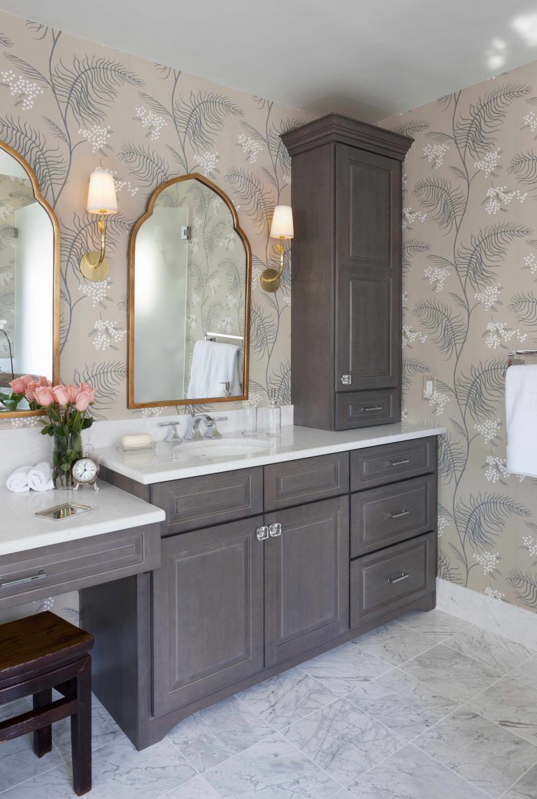 vanity area with gray toned cabinetry plenty of storage