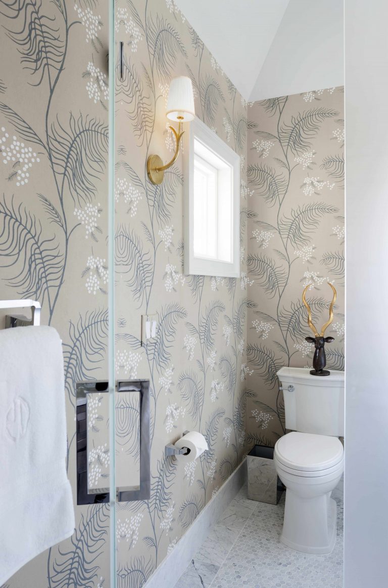 toilet area in renovated bathroom neutral floral wallpaper