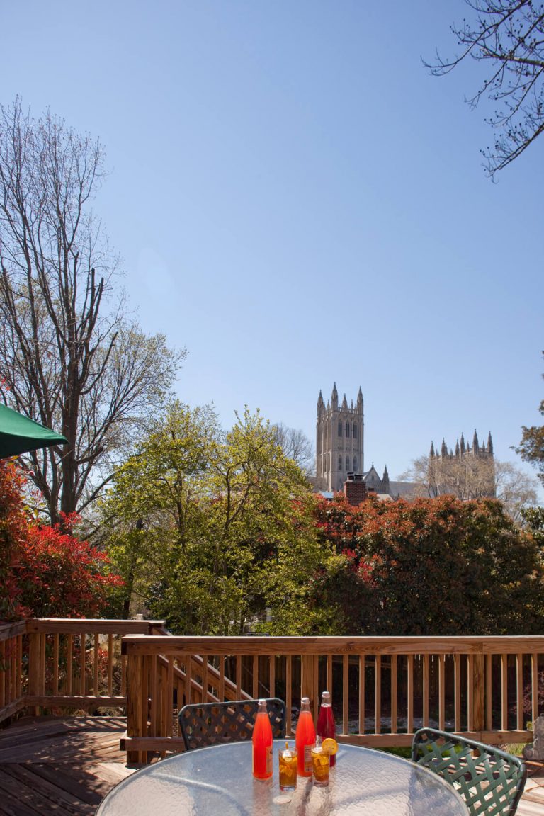 DC rowhouse addition upper deck seating area with view of National Cathedral