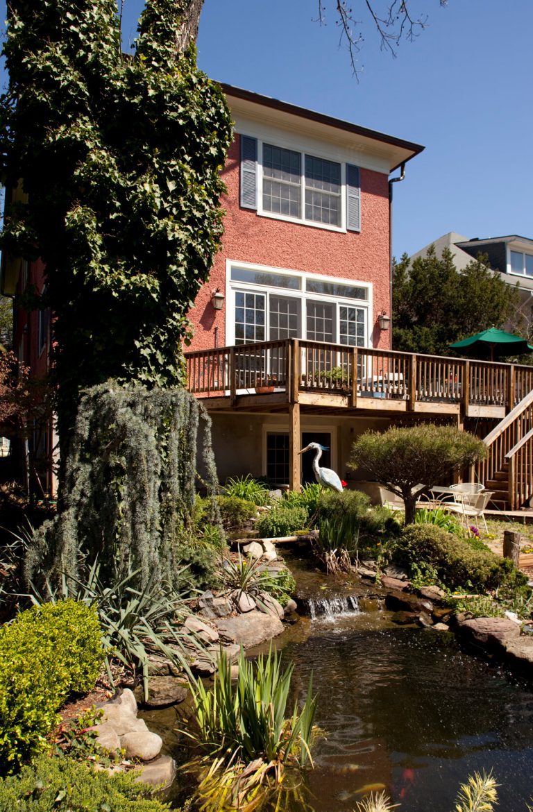 DC rowhouse with multi-level deck addition dark stained wood