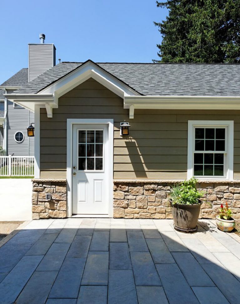 rear door and window of garage leading out to back patio beige neutral color palette