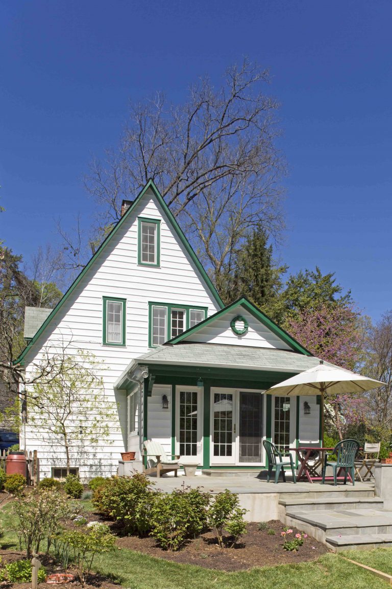 eclectic virginia home white with green trim back patio addition