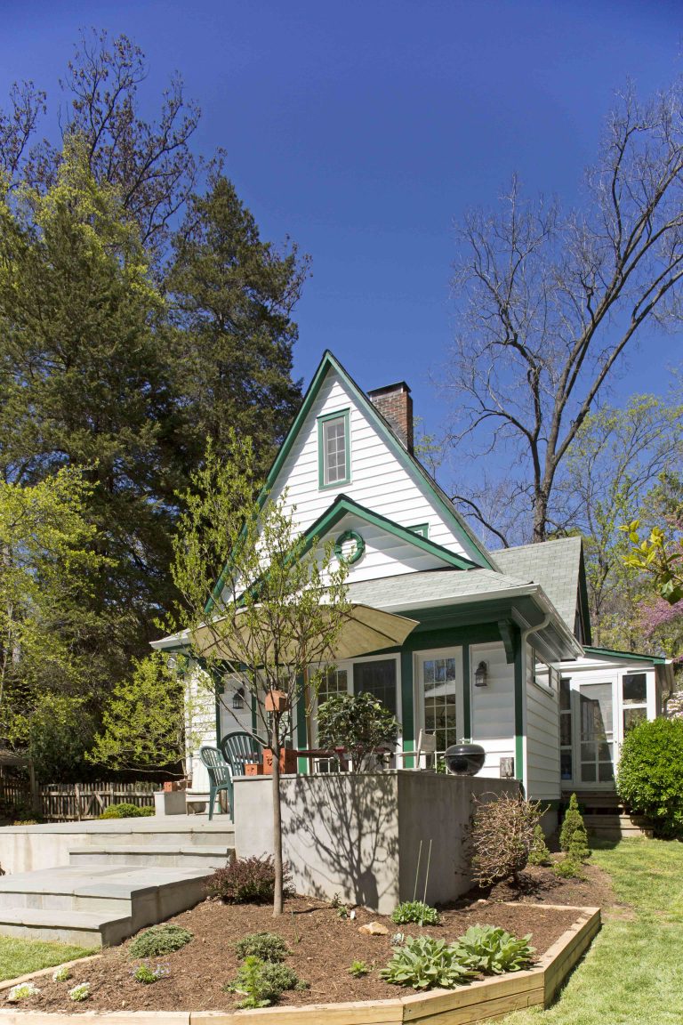 eclectic virginia home white with green trim back patio addition