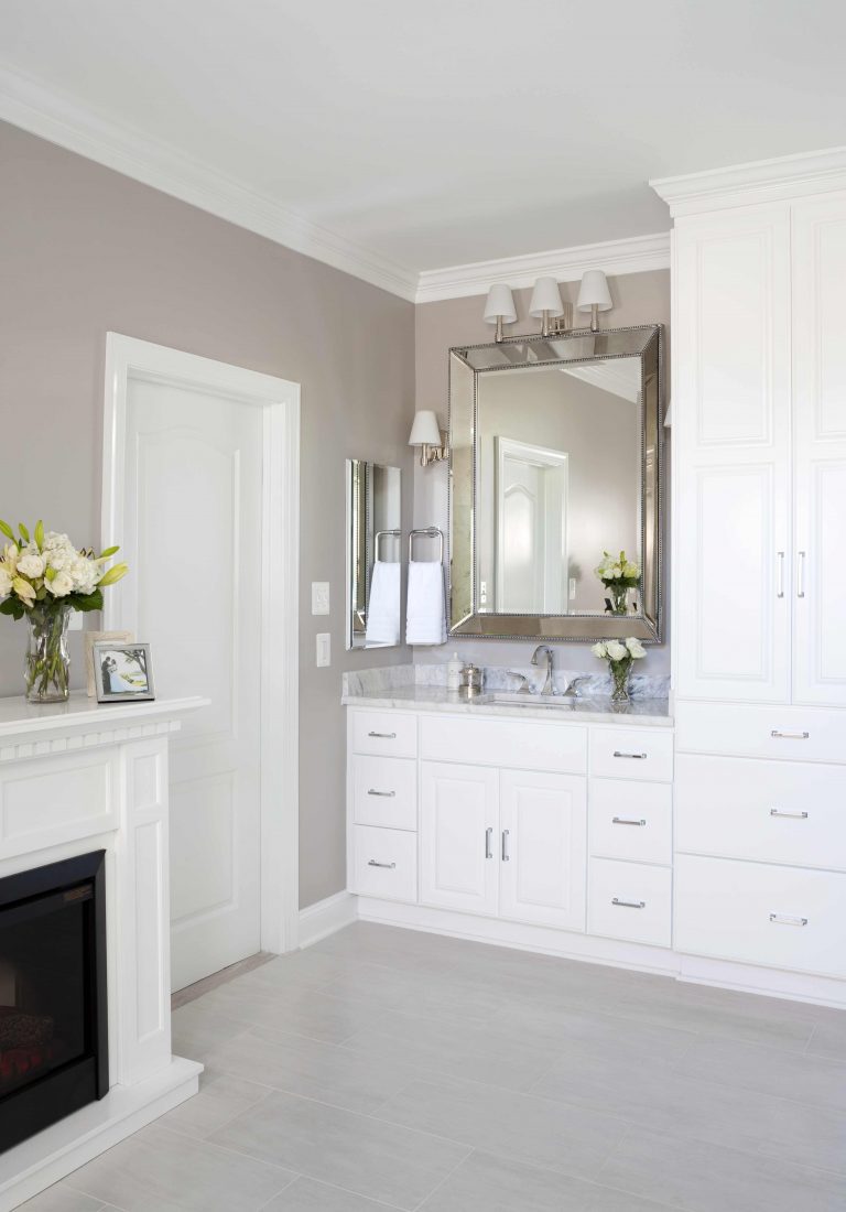 renovated bathroom traditional style neutral color palette lots of storage fireplace