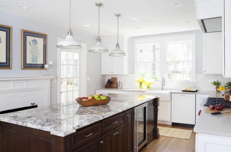 bright kitchen white outer cabinetry dark stain island pendant lighting