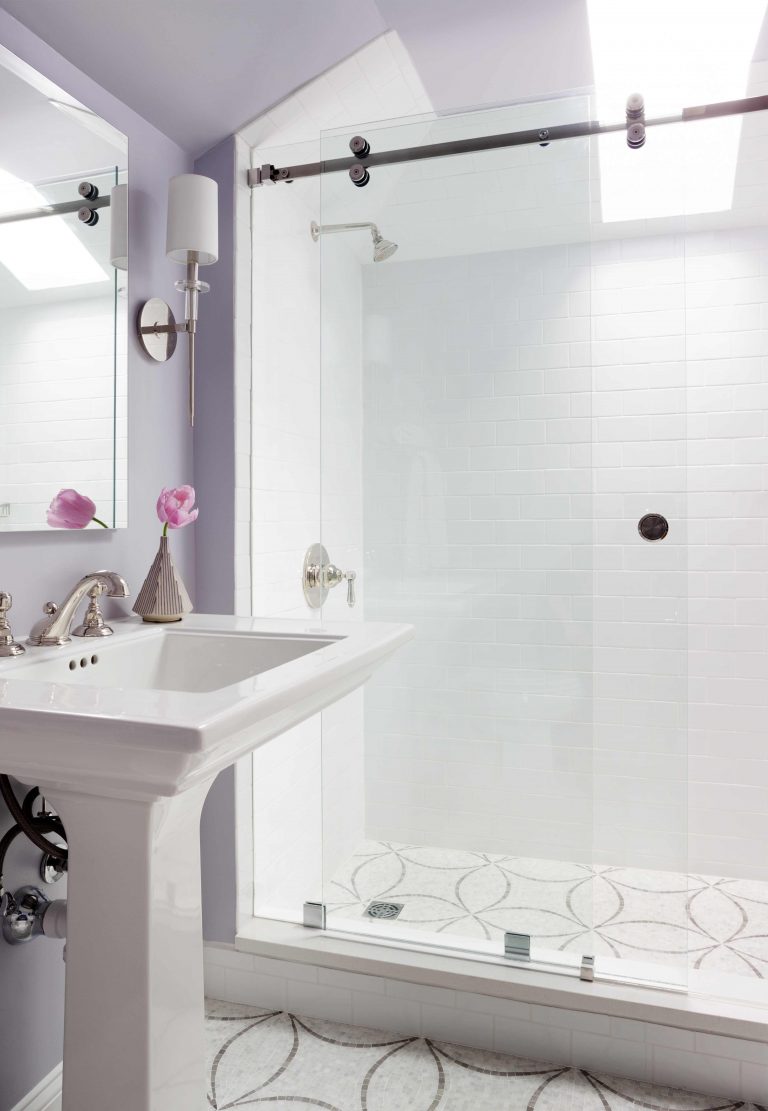 shower stall with glass door and skylight tile pattern on floor light purple walls