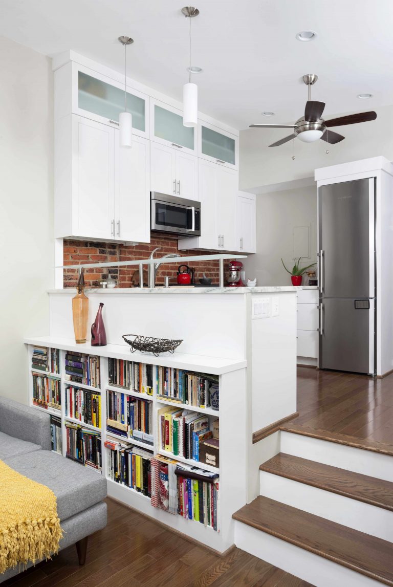 open split-level floorplan living room and kitchen built-in bookshelves
