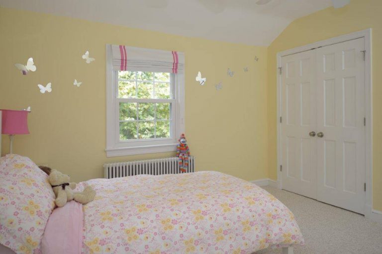 renovated children's bedroom soft yellow and pink color palette