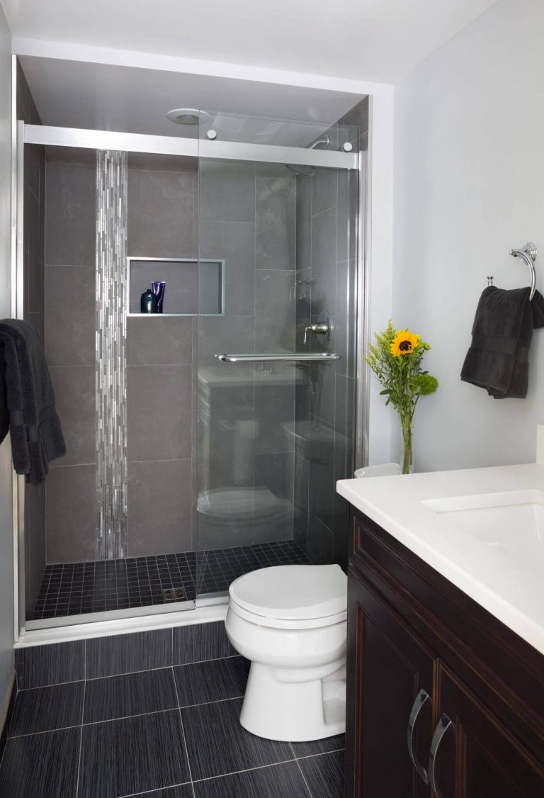 modern bathroom black tile glass shower doors metal tile accents