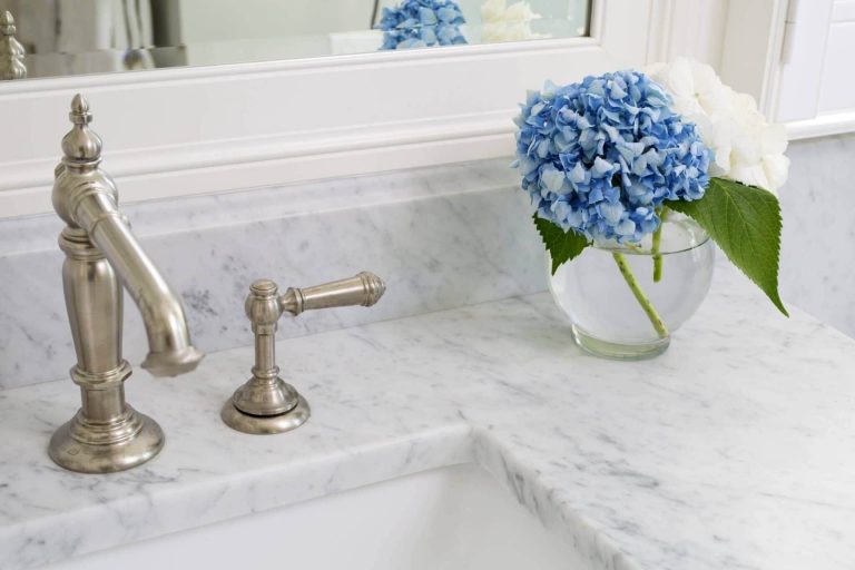 elegant bright and white bathroom marble countertops and brushed nickel fixtures