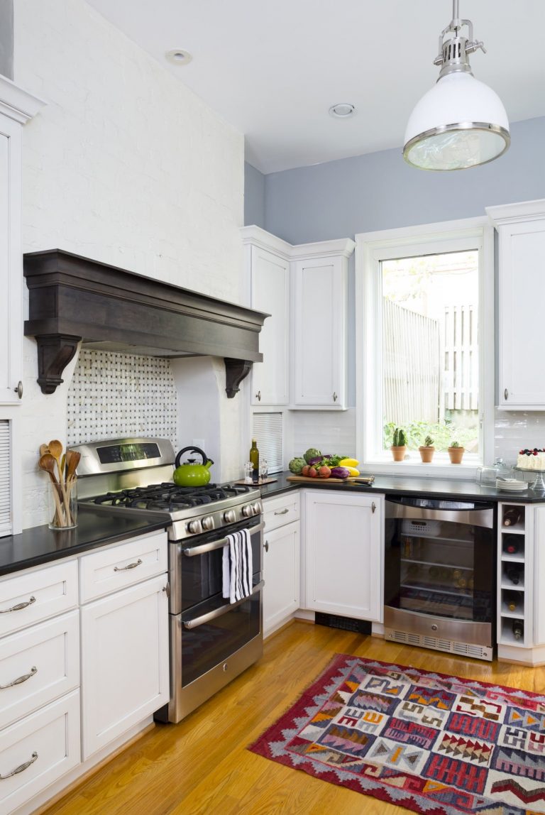 DC rowhouse kitchen white cabinets soft blue walls wood floors
