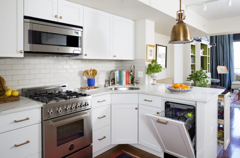 bright white kitchen with gold accents stainless steel appliances