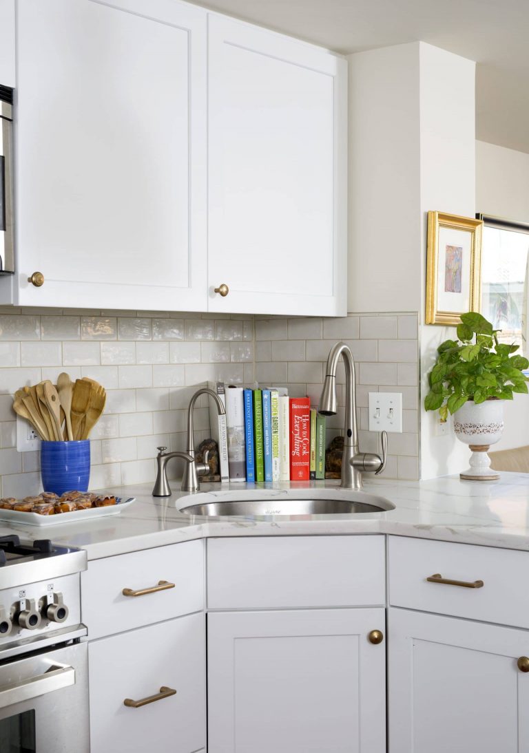 traditional kitchen white cabinetry with gold hardware white subway tile backsplash